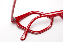 Load image into Gallery viewer, Abstract view of Edgy cat eye in glossy red reading glasses photographed on a white background. Designed and made by Nannini of Italy. Buy them at ReadingGlasses.CO/