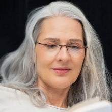 Load image into Gallery viewer, Female model reading in bed wearing Round Gels in Tortoise