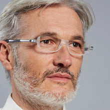 Load image into Gallery viewer, Male Model wearing Nannini Compact 2 foldable reading glasses in crystal.  Get them at ReadingGlasses.CO/