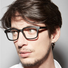 Load image into Gallery viewer, Nannini Art reading glasses on a male model. Buy at ReadingGlasses.CO/