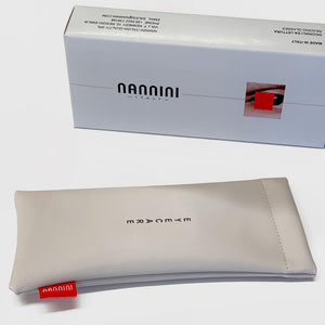 Nannini Gift box and beige squeeze case photographed on white background. 