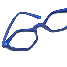 Load image into Gallery viewer, Face down view of Edgy Matte Blue Translucent Cat Eye reading glasses photographed on a white background. Designed and made by Nannini of Italy. Buy them at ReadingGlasses.CO/