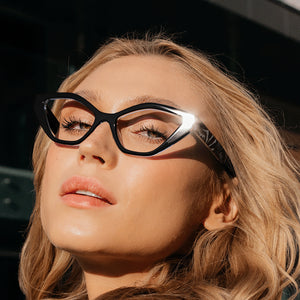 Female model wearing Black and zebra Maiden Lane cat eye reading glasses by Scojo. By ReadingGlasses.CO/