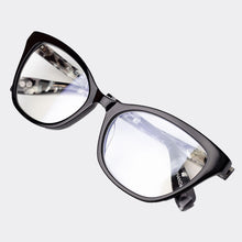 Load image into Gallery viewer, Lying down view of Scojo Essex premium reading glasses in black granite by Scojo New York. Style 1297. Buy them at ReadingGlasses.CO