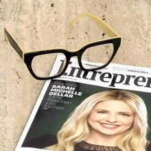 Load image into Gallery viewer, Moon Rocks Optical Reading Glasses with a copy of Entrepreneur magazine, eyewear in black and creme; by Aj Morgan. Buy the readers at ReadingGlasses.CO/