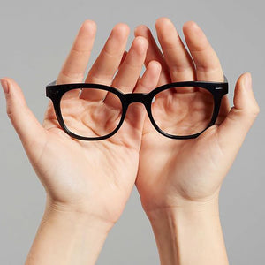 POP by Nannini in black. Held in 2 hands. Available at Reading Glasses.CO/